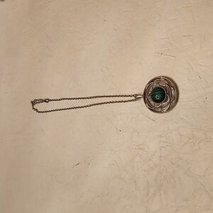 Green polished stone in silver tone setting necklace